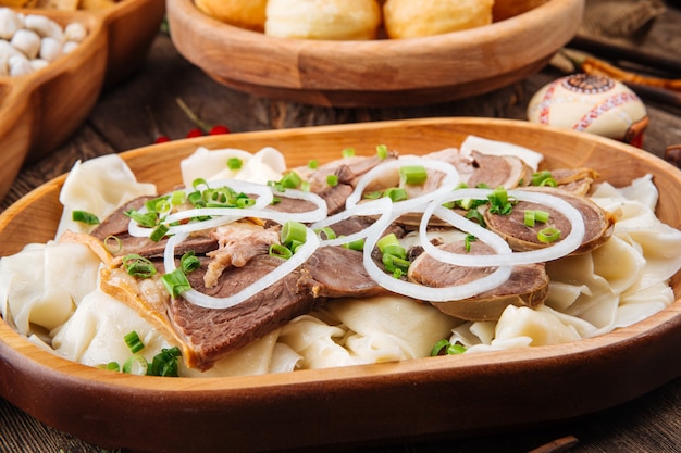 Kazakh festive national dish beshbarmak with horse meat and boiled dough