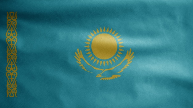 Kazakhstani flag waving in the wind. Close up of Kazakhstan banner blowing, soft and smooth silk. Cloth fabric texture ensign background. Use it for national day and country occasions concept.