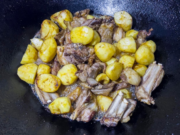 Kazan kebab is cooked in a cauldron with lamb potatoes