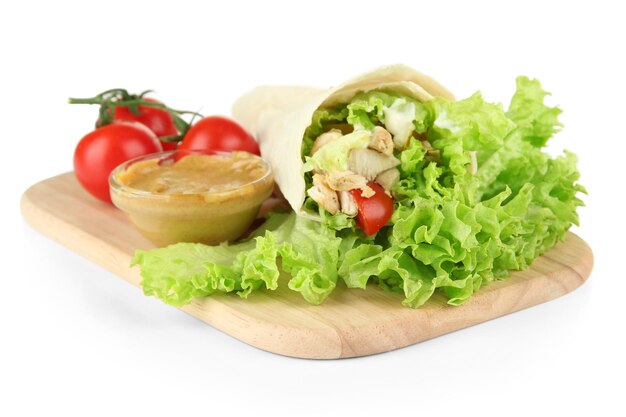 Kebab grilled meat and vegetables on wooden board isolated on white