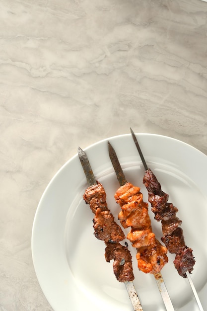 kebab and grilled vegetables isolated on a white background.