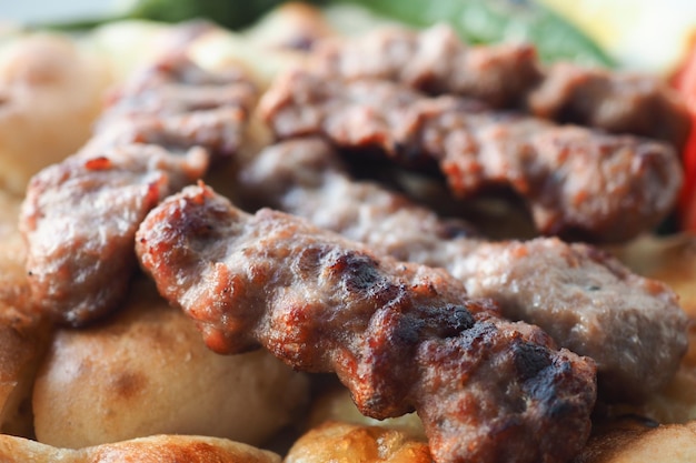 Kebab traditional turkish meat food with salad on a plate