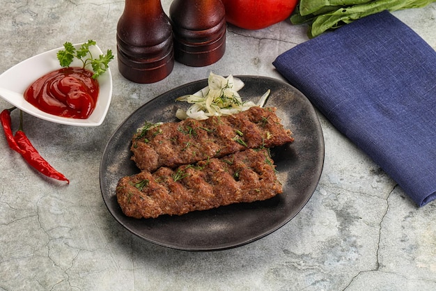 Kebab with beef served onion