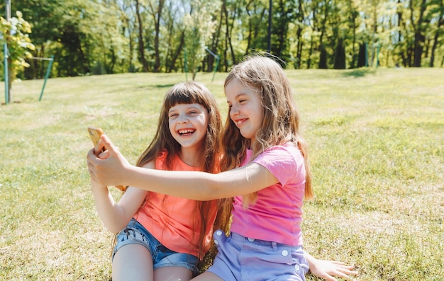 Photo keep a blog little girls take a selfie for a blog video call online social networks