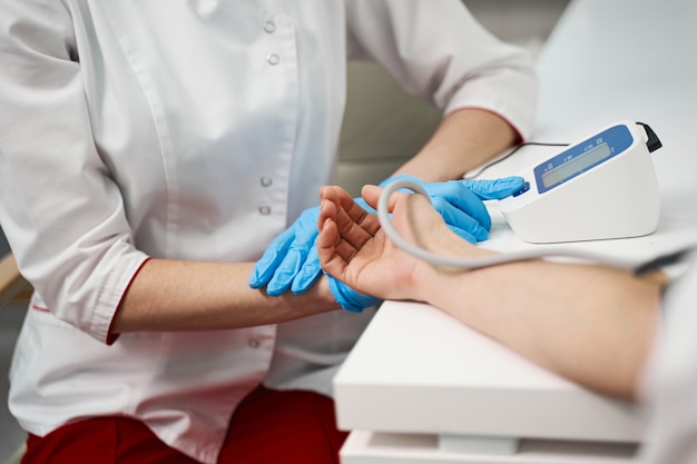 Keep calm. Close up of female hand that lying on table, young doctor consulting her patient