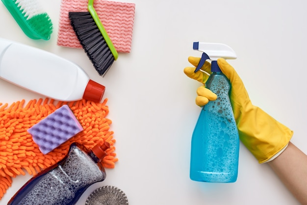 Keep cleaning. Spray bottle in human hands attacked other items isolated at the bottom of the picture