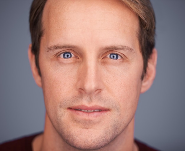 Keep it real Closeup studio portrait of a handsome man with blue eyes