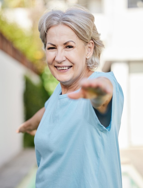 Keeping fit with yoga Shot of a senior woman doing yoga outside in her yard