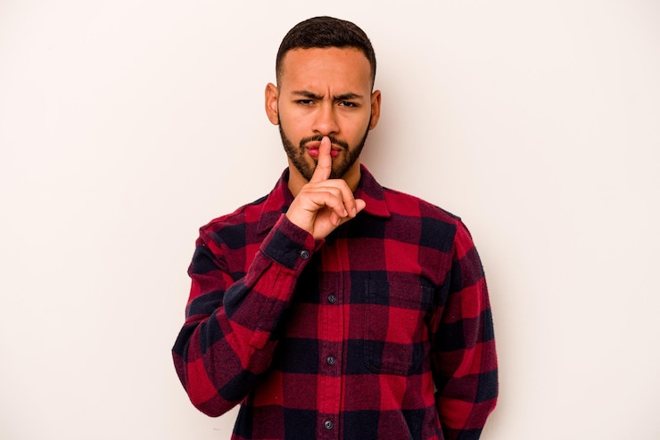 Photo keeping a secret or asking for silence