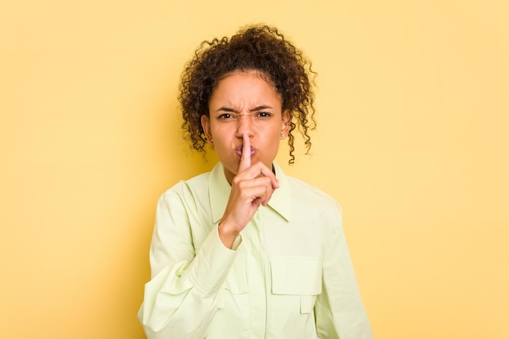 Photo keeping a secret or asking for silence