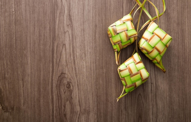 Kelongsong Ketupat decoration on wooden table