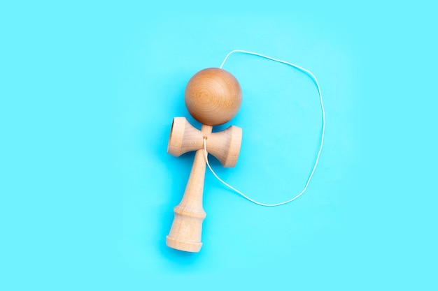 Kendama ball on blue background