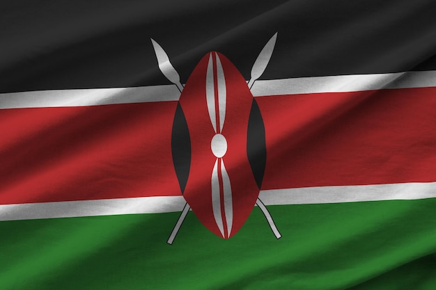 Kenya flag with big folds waving close up under the studio light indoors The official symbols and colors in banner