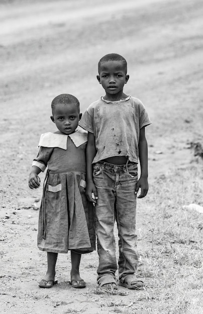 Kenyan kids on the road boy and girl's picture in Voi, Kenya