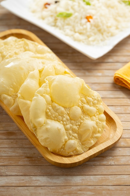 Kerala Papadum or plain pappadom  or Appalam arranged in a wooden board