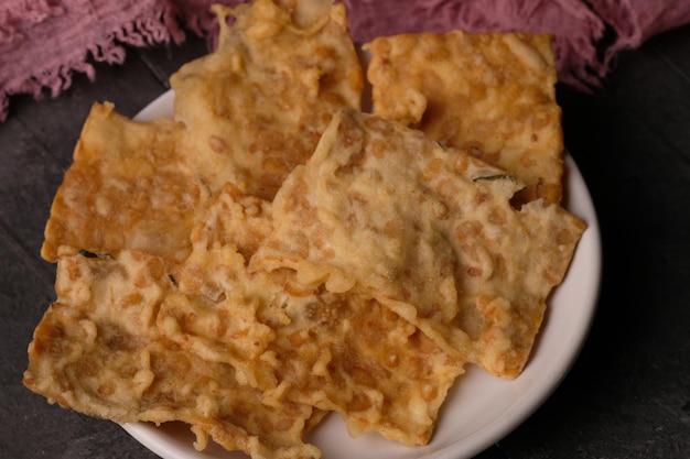 keripik kripik tempe. tempe chips, snacks with tempeh ingredients. tempeh is fermented soybeans.