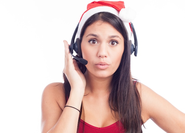 Kerst headset vrouw van telemarketing callcenter met rode kerstmuts praten