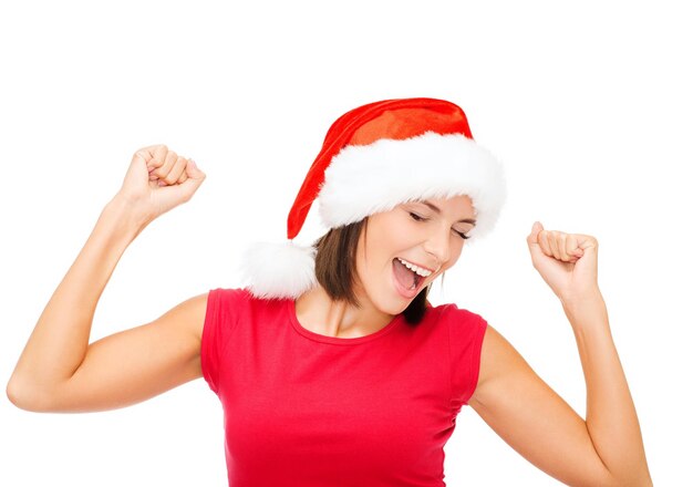 kerst, kerst, winter, geluk concept - lachende vrouw in santa helper hoed en rood shirt