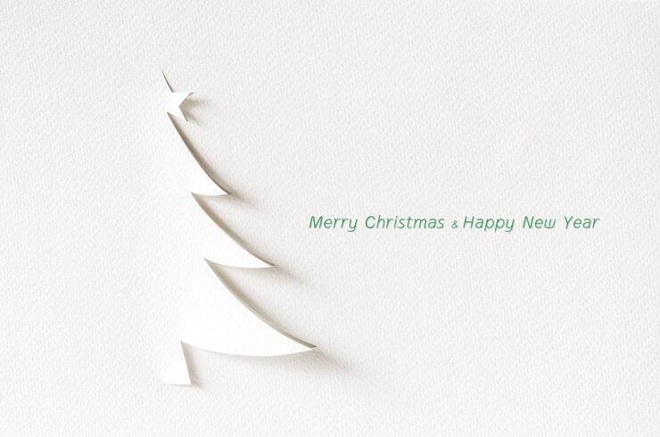 Foto kerstboomdocument scherpe ontwerpkaart. kerst papier ambacht.