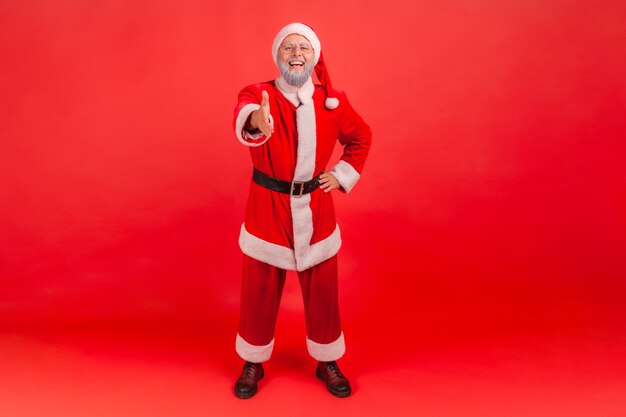 Kerstman hand geven aan handdruk en groet.