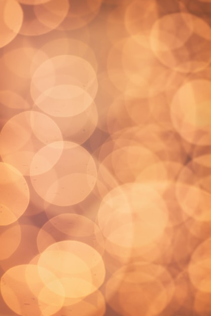 Kerstmis glanzende bokeh in geel gouden kleuren nieuwjaar illunination Seizoensgebonden vintage hipster vakantie achtergrond