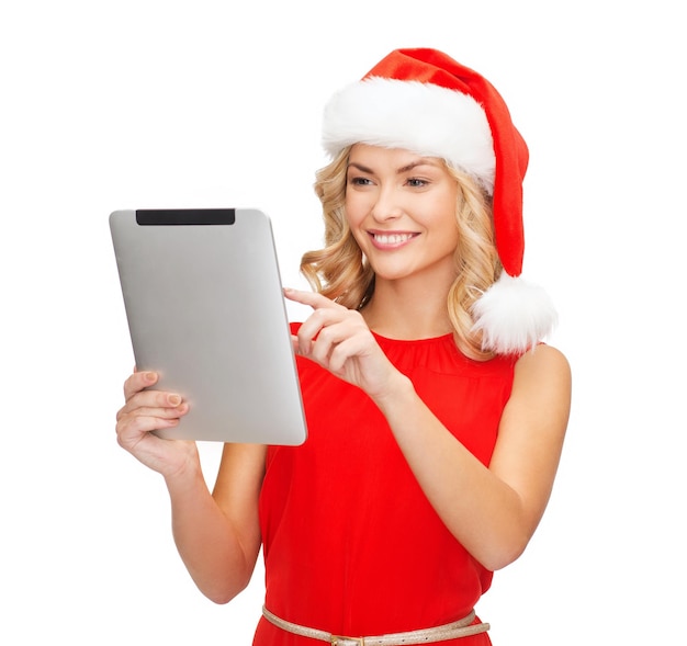 kerstmis, kerstmis, elektronica, gadgetconcept - glimlachende vrouw in santa helper hoed met tablet pc