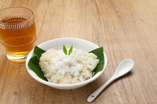 Ketan Kelapa Parut, Indonesian traditional snack, steamed glutinous rice with grated coconut