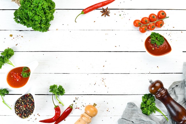 Ketchup barbecue sauce tomato sauce A set of tomato sauces on a white wooden background Top view Free space for your text