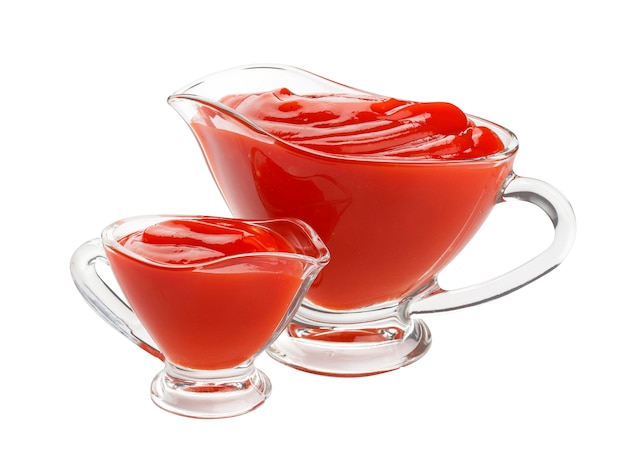 Ketchup in glass bowl on white background