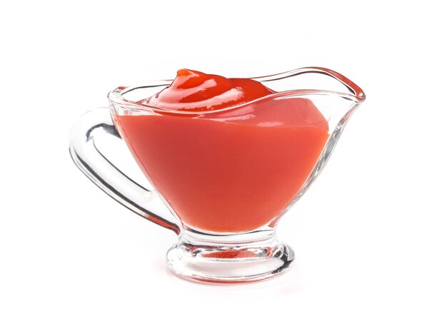 Ketchup in glass bowl on white 