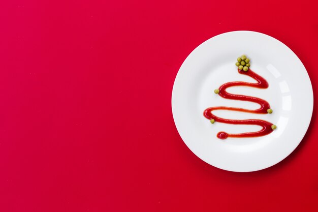 Ketchup in a white plate looks like a Christmas tree