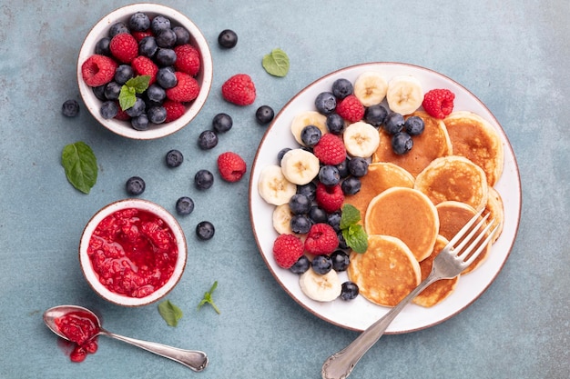 Keto diet pancakes made or almond flour, served with berries.