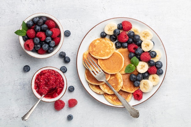 Keto diet pancakes made or almond flour, served with berries.