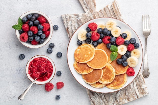 Keto diet pancakes made or almond flour, served with berries.