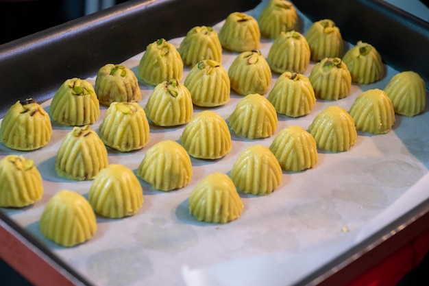 Keto eid kahk with almond dough arranged in a grill tray