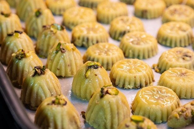 Keto eid kahk with almond dough arranged in a grill tray