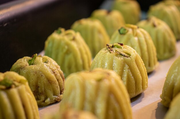 Keto eid kahk with almond dough arranged in a grill tray