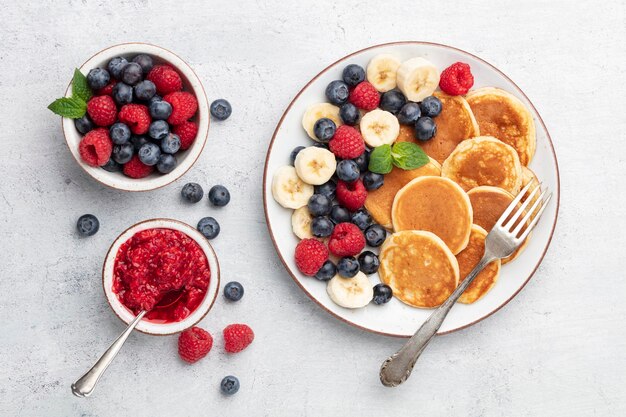 Keto pancakes made of diet flour or almond flour, served with berries.