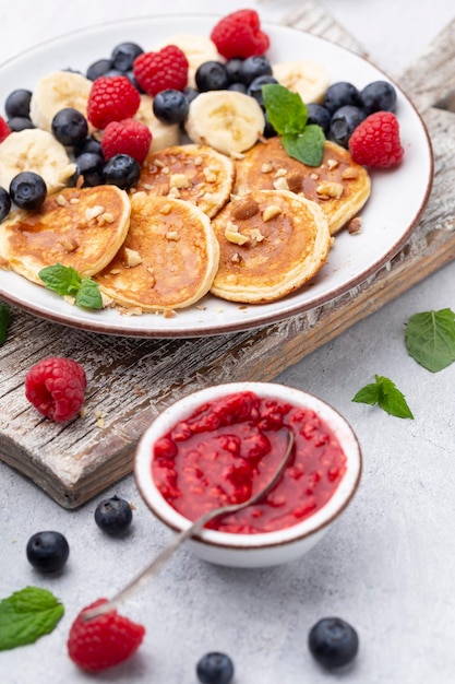 Keto pancakes made of diet flour or almond flour, served with berries.