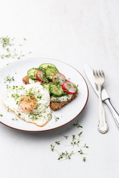 keto toasts with cucumber egg mozzarella and microgreens
