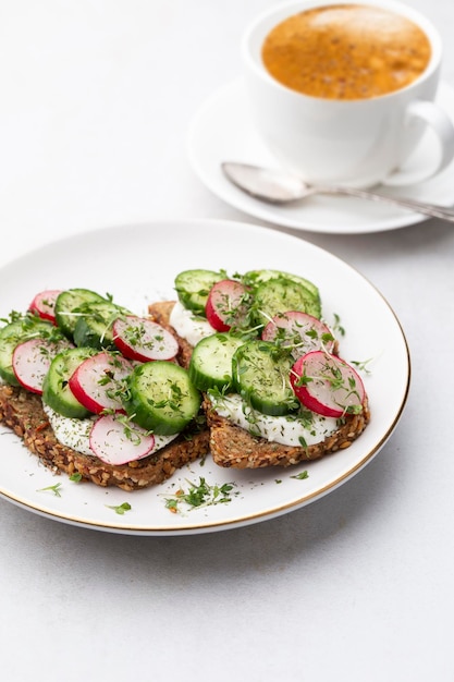 keto toasts with cucumber egg mozzarella and microgreens