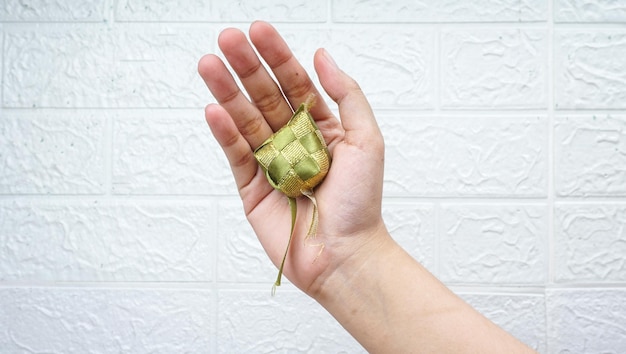 Ketupat Indonesia or Rice Cube over White Wall