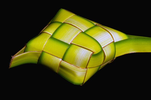 Ketupat Lebaran, a rice cake packed inside a diamond shaped container of woven coconut leaves, served in the end of Ramadan and in Eid Fitr (Eid Mubarak) in Indonesia, Malaysia, Brunei and Singapore