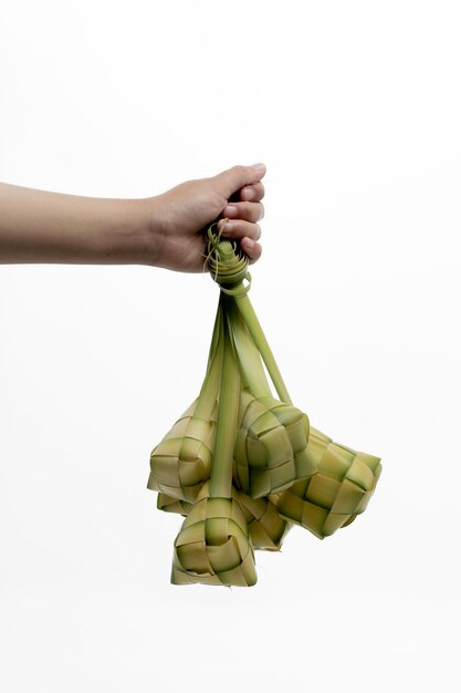 Ketupat Pouch on hand isolated on a white background