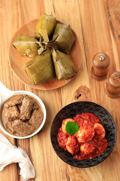 Ketupat Rendang and Telur Balado TOp View on Wooden Table Menu Lebaran Dish