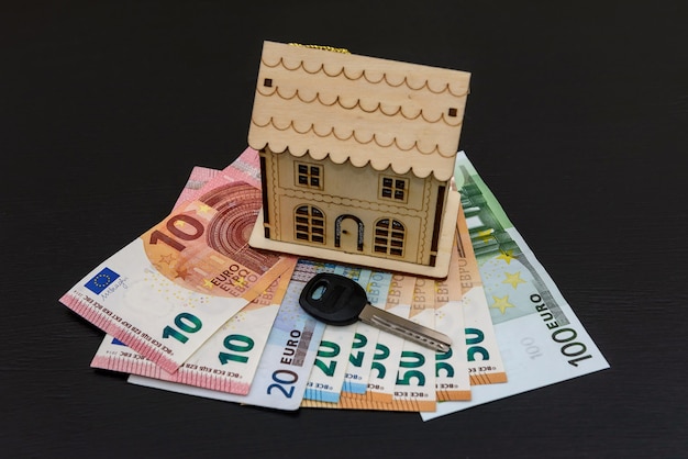 Key and house model on euro banknotes