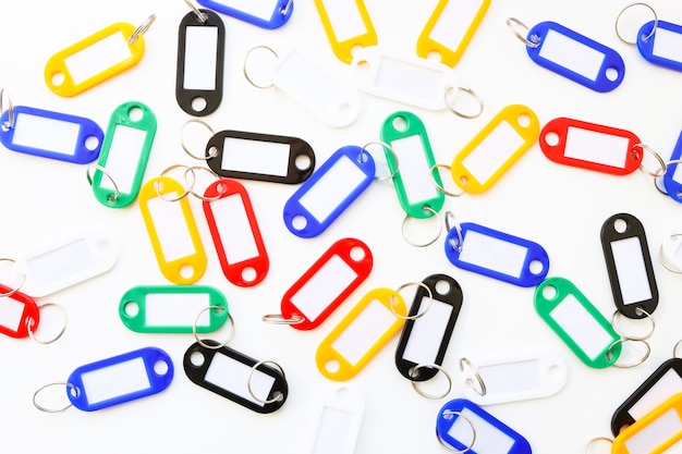 Key tags in different colors on a white background