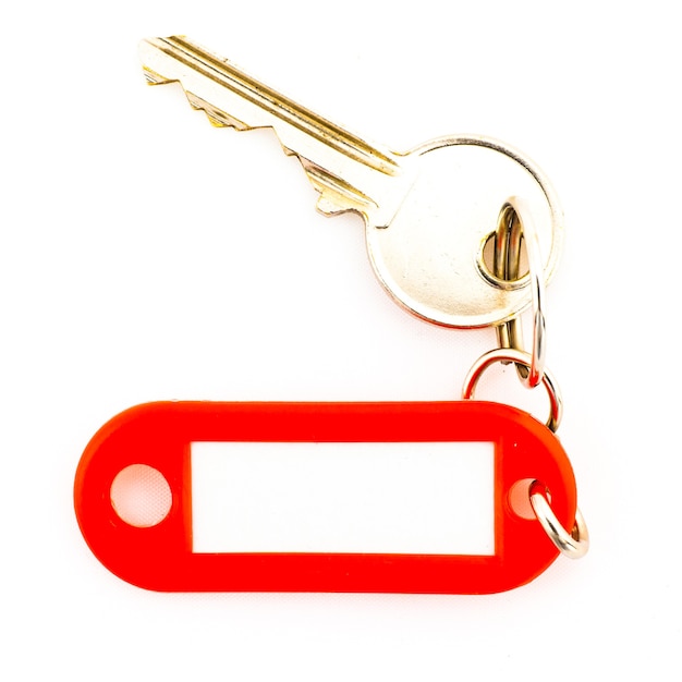 Key with a blank tag, isolate on white background. Add your text on the tag.