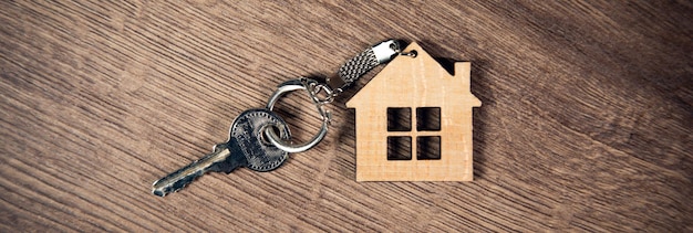 Photo key with trinket in shape of house