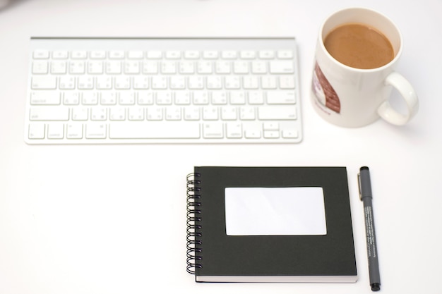 Keyboard, ,coffee, pen, notebook, notepad